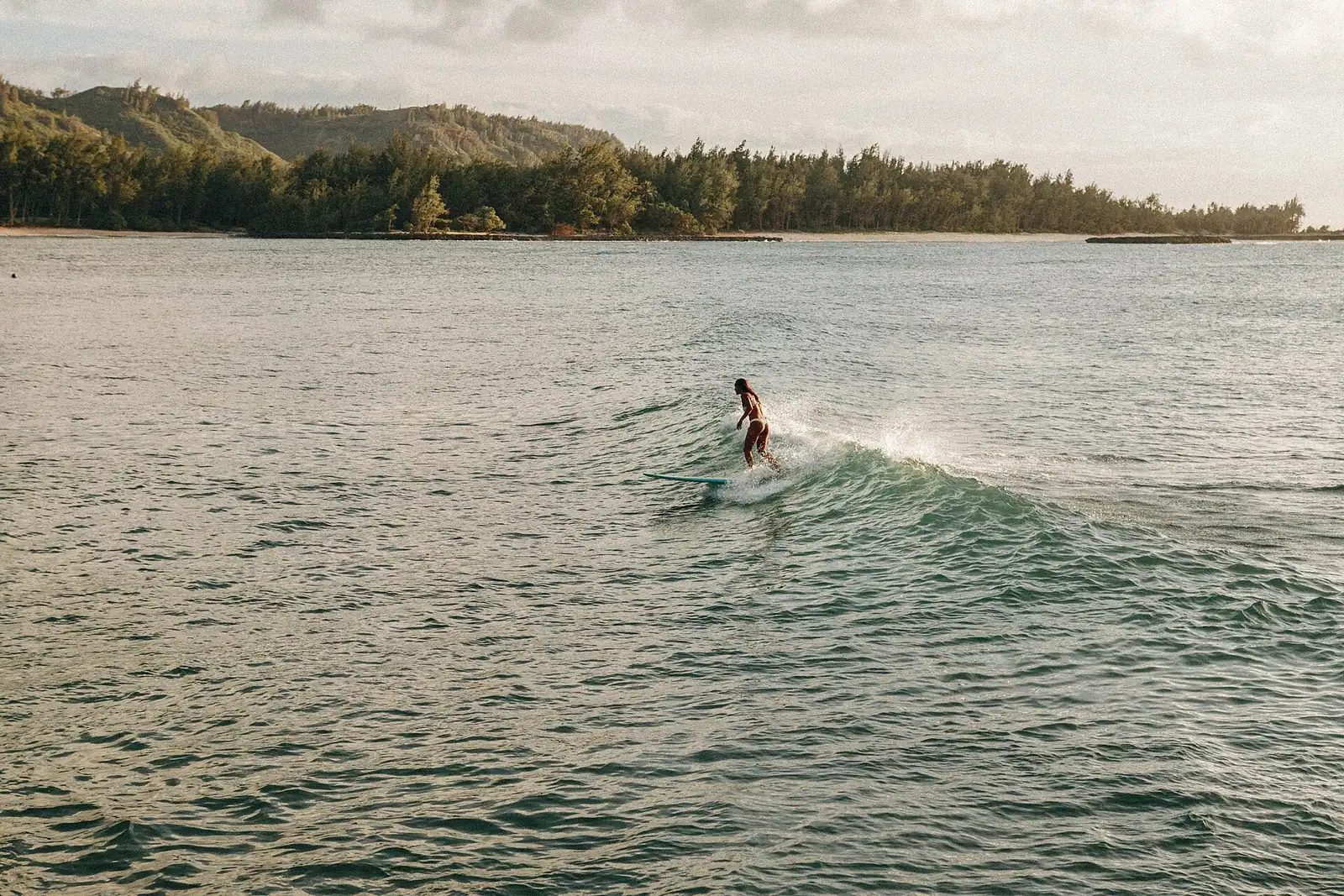 A small sheltered cove of calm shallow water held behind an offshore reef